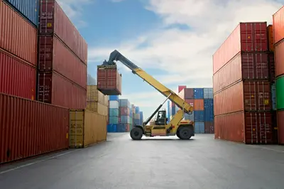 A container ship sailing on the ocean, symbolizing the significance of maritime shipping in facilitating global trade and the transportation of goods across oceans and continents.